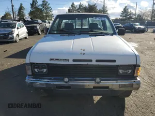 1987 Nissan Hardbody E z VIN JN6ND11S4HW011430, wystawiony jako Copart lot #81785214 z przebiegiem 334 566 mil mil oraz Tytuł czysty. Historia ofert i sprzedaży dostępna na DreamBid. Obrazek 5.