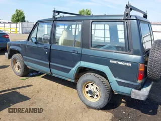 1990 Isuzu Trooper z VIN JACCH58EXL7903060, wystawiony jako IAAI lot #42516100 z przebiegiem 189 700 mil mil oraz . Historia ofert i sprzedaży dostępna na DreamBid. Obrazek 3.