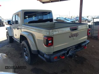 2022 Jeep Gladiator Rubicon with VIN 1C6JJTBG2NL164117, listed as a IAAI auction lot 42450350 with 22,326 mi miles and . Bid and sale history available at DreamBid. Image 3.