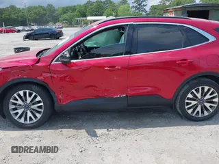 2020 Ford Escape Titanium z VIN 1FMCU9J92LUA39457, wystawiony jako IAAI lot #42222441 z przebiegiem 107 148 mil mil oraz . Historia ofert i sprzedaży dostępna na DreamBid. Obrazek 14.