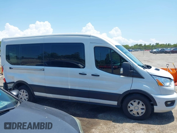 2020 Ford Transit Passenger XL z VIN 1FBAX2C80LKA23515, wystawiony jako IAAI lot #42176965 z przebiegiem 219 360 mil mil oraz . Historia ofert i sprzedaży dostępna na DreamBid. Obrazek 13.