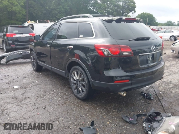 2015 Mazda CX-9 Grand Touring with VIN JM3TB2DA1F0464517, listed as a IAAI auction lot 42484985 with 104,932 mi miles and . Bid and sale history available at DreamBid. Image 3.