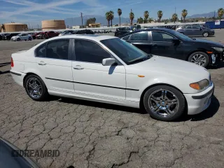2005 BMW 3 Series 330i with VIN WBAEV53455KM41084, listed as a Copart auction lot 50338425 with 223,116 mi miles and Salvage title. Bid and sale history available at DreamBid. Image 4.