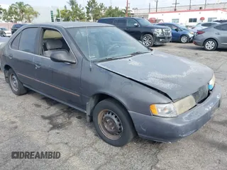 1997 Nissan Sentra XE z VIN 1N4AB41D6VC746343, wystawiony jako IAAI lot #40291850 z przebiegiem 115 307 mil mil oraz . Historia ofert i sprzedaży dostępna na DreamBid. Obrazek 1.