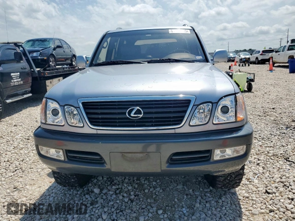 2001 Lexus LX 470 z VIN JTJHT00W313504330, wystawiony jako Copart lot #61126435 z przebiegiem 87 049 mil mil oraz Czysty tytuł • Clean title. Historia ofert i sprzedaży dostępna na DreamBid. Obrazek 5.