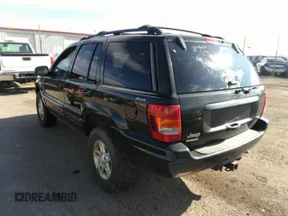 1999 Jeep Grand Cherokee Limited with VIN 1J4GW68N8XC770305, listed as a IAAI auction lot 41720558 with 206,180 mi miles. Bid and sale history available at carsss.com. Image 3.