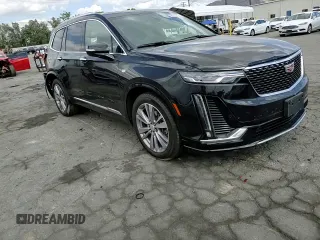 2023 Cadillac XT6 FWD Premium Luxury with VIN 1GYKPCRS5PZ220616, listed as a Copart auction lot 56913725 with 25,860 mi miles and Salvage title. Bid and sale history available at DreamBid. Image 14.