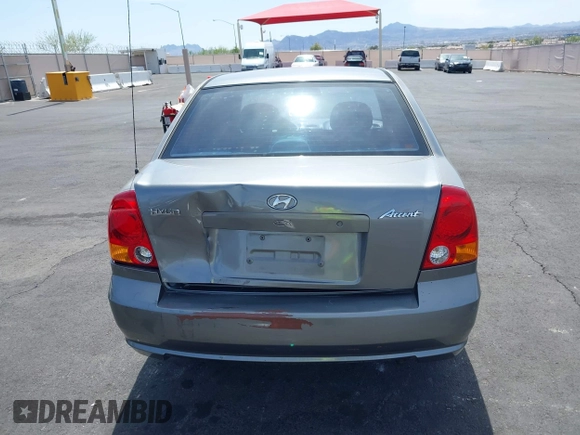 2003 Hyundai Accent GL with VIN KMHCG45C73U471607, listed as a IAAI auction lot 41956551 with 222,305 mi miles. Bid and sale history available at carsss.com. Image 14.