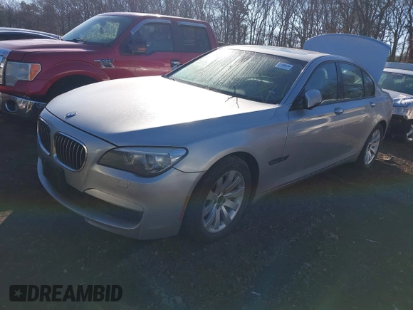2014 BMW 7 Series 740i with VIN WBAYA6C54ED144450, listed as a IAAI auction lot 41680060 with 999,999 mi miles. Bid and sale history available at carsss.com. Image 2.