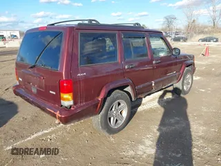 2000 Jeep Cherokee Classic with VIN 1J4FF58S7YL122676, listed as a IAAI auction lot 41710310 with 124,758 mi miles. Bid and sale history available at carsss.com. Image 4.