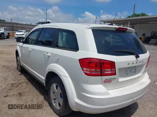 2013 Dodge Journey American Value with VIN 3C4PDCAB2DT587430, listed as a IAAI auction lot 42229391 with 218,016 mi miles and . Bid and sale history available at DreamBid. Image 3.