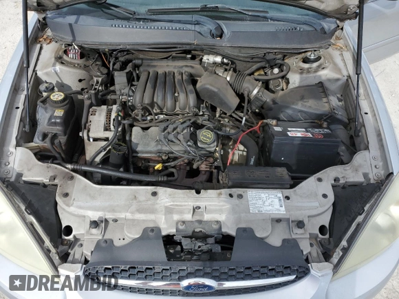 2003 Ford Taurus LX Standard z VIN 1FAFP52U43A110444, wystawiony jako Copart lot #83557764 z przebiegiem 118 897 mil mil oraz Szkoda całkowita • Salvage title. Historia ofert i sprzedaży dostępna na DreamBid. Obrazek 11.