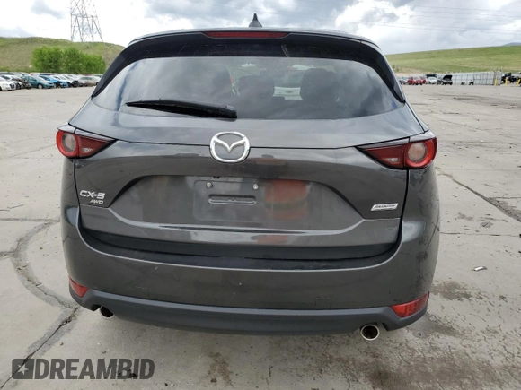 2018 Mazda CX-5 Touring z VIN JM3KFBCM4J0349687, wystawiony jako Copart lot #55857945 z przebiegiem Nie podano mil oraz Szkoda całkowita • Salvage title. Historia ofert i sprzedaży dostępna na DreamBid. Obrazek 6.