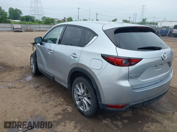 2021 Mazda CX-5 Grand Touring with VIN JM3KFBDM4M0371496, listed as a IAAI auction lot 42428860 with 113,735 mi miles and . Bid and sale history available at DreamBid. Image 3.