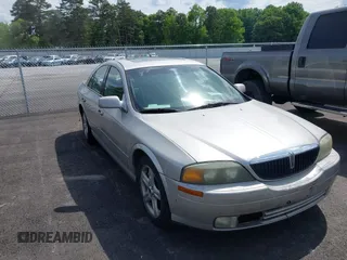 2002 Lincoln LS w/Base Pkg z VIN 1LNHM87A22Y703507, wystawiony jako IAAI lot #42243775 z przebiegiem 245 300 mil mil oraz . Historia ofert i sprzedaży dostępna na DreamBid. Obrazek 1.