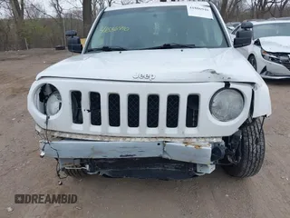 2014 Jeep Patriot Sport with VIN 1C4NJRBB9ED852112, listed as a IAAI auction lot 41886940 with 138,825 mi miles. Bid and sale history available at carsss.com. Image 6.