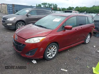 2012 Mazda 5 Grand Touring with VIN JM1CW2DLXC0134997, listed as a IAAI auction lot 42360574 with 230,951 mi miles and . Bid and sale history available at DreamBid. Image 2.