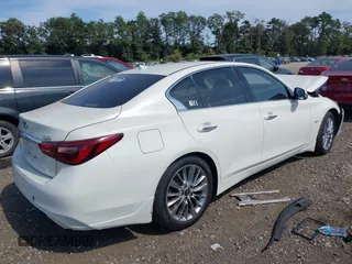 2019 Infiniti Q50 Luxe with VIN JN1EV7ARXKM557946, listed as a IAAI auction lot 40362058 with 56,615 mi miles and . Bid and sale history available at carsss.com. Image 4.