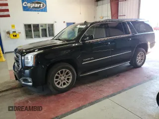 2015 GMC Yukon XL SLE z VIN 1GKS2GKC4FR229437, wystawiony jako Copart lot #56910715 z przebiegiem 157 599 mil mil oraz Szkoda całkowita • Salvage title. Historia ofert i sprzedaży dostępna na DreamBid. Obrazek 1.