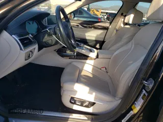2016 BMW 7 Series 740i with VIN WBA7E2C59GG504533, listed as a Copart auction lot 77122283 with 68,209 mi miles. Bid and sale history available at carsss.com. Image 7.