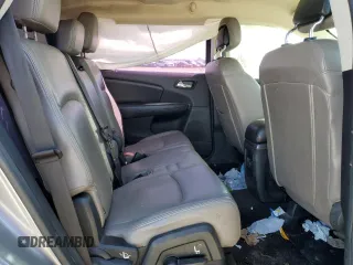 2015 Dodge Journey American Value with VIN 3C4PDCABXFT712192, listed as a Copart auction lot 55680975 with 104,579 mi miles and Salvage Title. Bid and sale history available at DreamBid. Image 11.