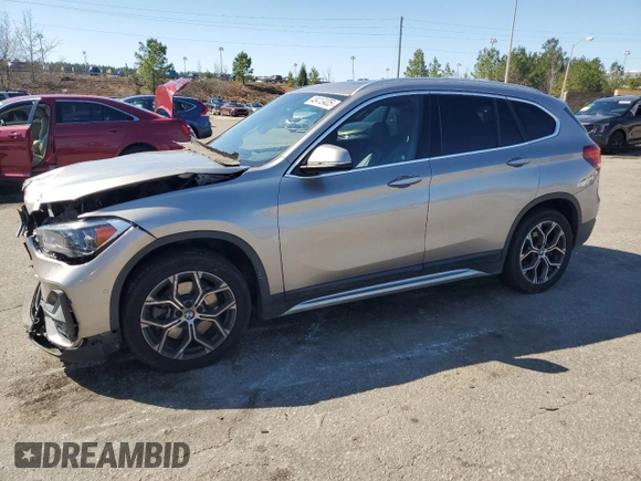 2021 BMW X1 sDrive28i with VIN WBXJG7C0XM5S33884, listed as a Copart auction lot 48413405 with 89,698 mi miles and Salvage Title. Bid and sale history available at DreamBid. Image 1.