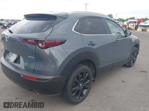 2022 Mazda CX-30 S Carbon Edition with VIN 3MVDMBCL6NM431985, listed as a IAAI auction lot 42610558 with Not provided miles and . Bid and sale history available at DreamBid. Image 4.
