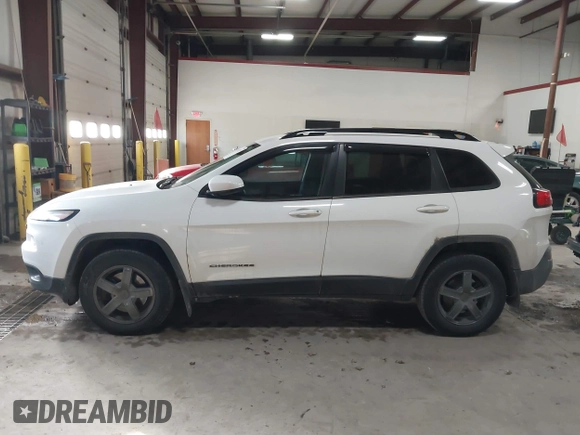 2014 Jeep Cherokee Latitude with VIN 1C4PJMCS5EW288909, listed as a IAAI auction lot 41531117 with 108,971 mi miles and . Bid and sale history available at DreamBid. Image 14.