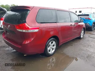 2014 Toyota Sienna L with VIN 5TDZK3DC0ES457242, listed as a IAAI auction lot 42307360 with 86,857 mi miles and . Bid and sale history available at DreamBid. Image 4.