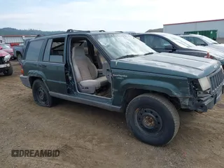 1994 Jeep Grand Cherokee Laredo z VIN 1J4GZ58S9RC215874, wystawiony jako IAAI lot #42577378 z przebiegiem 230 824 mil mil oraz . Historia ofert i sprzedaży dostępna na DreamBid. Obrazek 1.