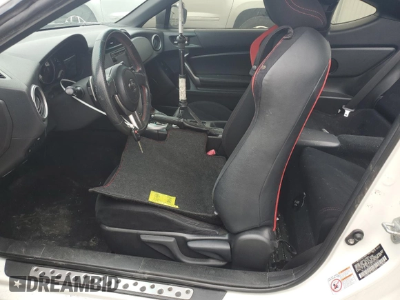 2015 Scion FR-S z VIN JF1ZNAA14F8703283, wystawiony jako Copart lot #50995885 z przebiegiem 101 033 mil mil oraz Szkoda całkowita • Salvage title. Historia ofert i sprzedaży dostępna na DreamBid. Obrazek 7.