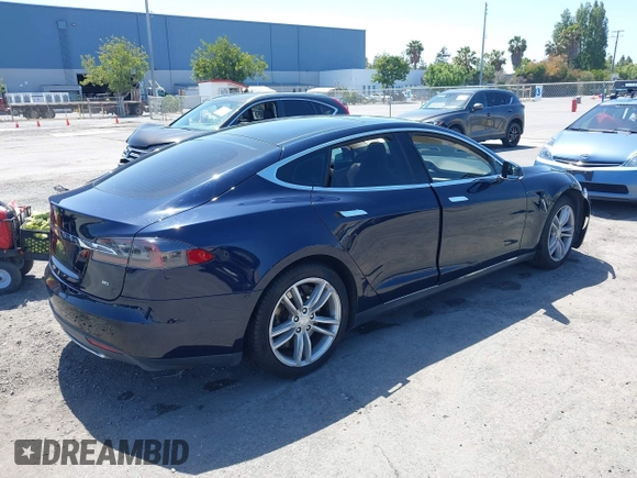 2014 Tesla Model S 60 with VIN 5YJSA1H12EFP46760, listed as a IAAI auction lot 42344596 with 106,252 mi miles and . Bid and sale history available at DreamBid. Image 4.
