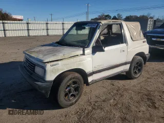 1990 Geo Tracker z VIN 2CNBJ18UXL6217744, wystawiony jako Copart lot #84203244 z przebiegiem 23 221 mil mil oraz Szkody całkowita. Historia ofert i sprzedaży dostępna na DreamBid. Obrazek 1.