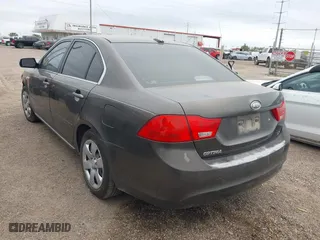 2009 Kia Optima LX with VIN KNAGE228X95299444, listed as a IAAI auction lot 41953241 with 201,170 mi miles. Bid and sale history available at carsss.com. Image 3.