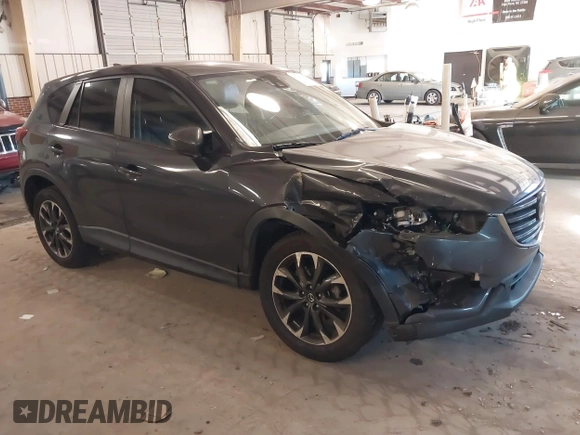 2016 Mazda CX-5 Grand Touring with VIN JM3KE2DYXG0846787, listed as a IAAI auction lot 41346364 with 113,553 mi miles. Bid and sale history available at carsss.com. Image 1.