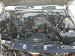 1995 Nissan Frontier XE z VIN 1N6HD16S2SC336866, wystawiony jako Copart lot #56041925 z przebiegiem 187 337 mil mil oraz Szkoda całkowita • Salvage title. Historia ofert i sprzedaży dostępna na DreamBid. Obrazek 11.
