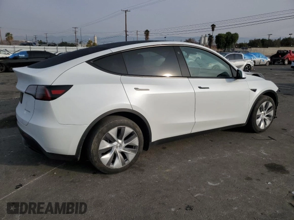 2023 Tesla Model Y Long Range with VIN 7SAYGDEE5PA125887, listed as a Copart auction lot 43188655 with 31,472 mi miles and Salvage Title. Bid and sale history available at DreamBid. Image 3.