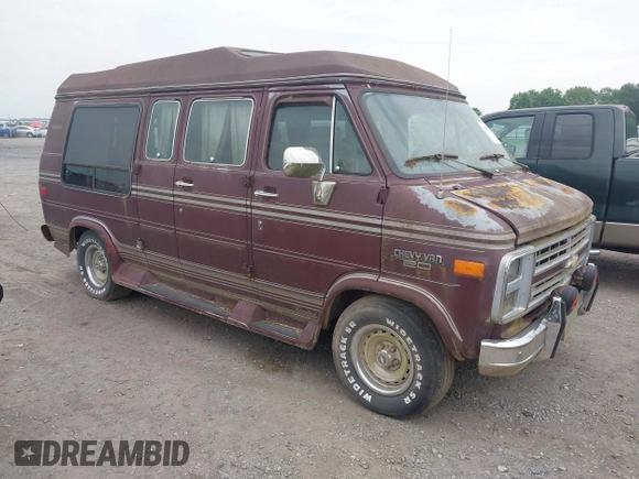 1989 Chevrolet Chevy Van z VIN 1GBEG25K5K7184695, wystawiony jako IAAI lot #42432728 z przebiegiem 945 928 mil mil oraz . Historia ofert i sprzedaży dostępna na DreamBid. Obrazek 1.