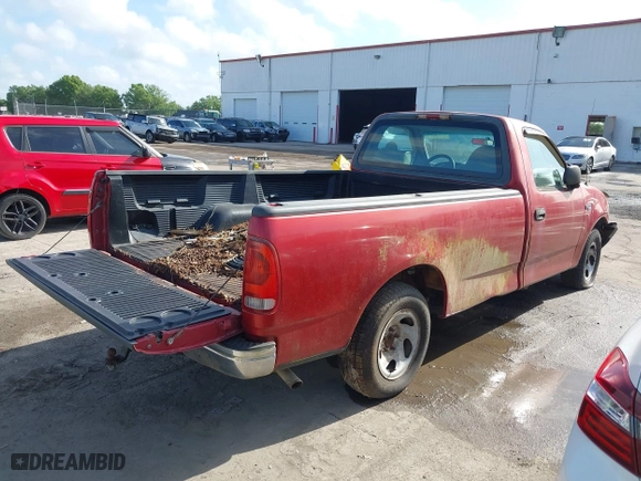 1999 Ford F-150 Work Series with VIN 1FTZF1727XKA70063, listed as a IAAI auction lot 41948032 with 134,642 mi miles. Bid and sale history available at carsss.com. Image 4.