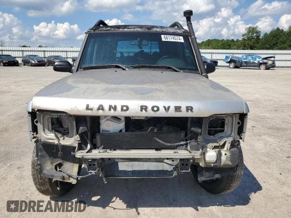 2004 Land Rover Discovery SE z VIN SALTY194X4A859428, wystawiony jako Copart lot #68174574 z przebiegiem Nie podano mil oraz Czysty tytuł • Clean title. Historia ofert i sprzedaży dostępna na DreamBid. Obrazek 5.