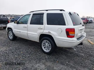 2002 Jeep Grand Cherokee Limited with VIN 1J8GX58N42C283956, listed as a IAAI auction lot 41553997 with 214,388 mi miles and . Bid and sale history available at DreamBid. Image 3.