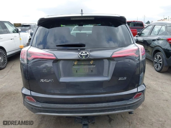2018 Toyota RAV4 XLE with VIN JTMWFREV4JJ742463, listed as a IAAI auction lot 41920716 with 61,141 mi miles. Bid and sale history available at carsss.com. Image 16.