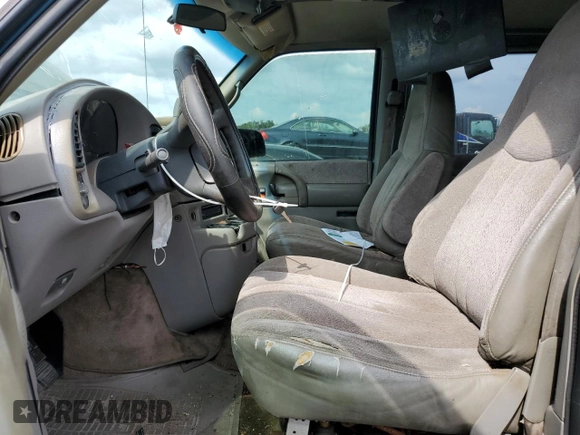 2000 Chevrolet Astro with VIN 1GNDM19W1YB143971, listed as a Copart auction lot 77984874 with 278,301 mi miles and Salvage Title. Bid and sale history available at carsss.com. Image 7.