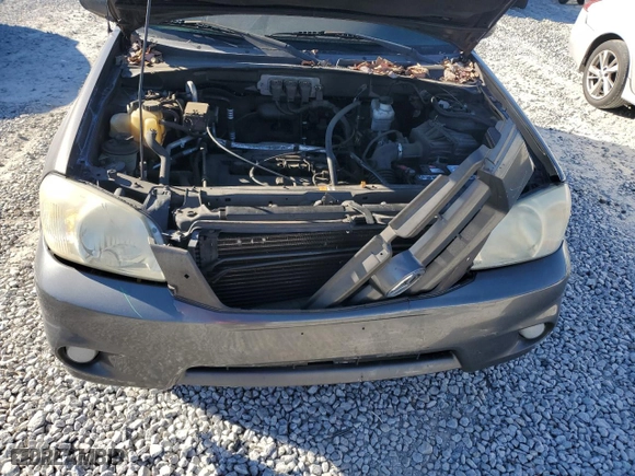 2006 Mazda Tribute i with VIN 4F2YZ02Z86KM09784, listed as a Copart auction lot 86127074 with 142,524 mi miles and Salvage Title. Bid and sale history available at carsss.com. Image 12.