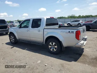 2010 Nissan Frontier Pro-4X with VIN 1N6AD0EV5AC435641, listed as a Copart auction lot 63388025 with 84,349 mi miles and Salvage title. Bid and sale history available at DreamBid. Image 2.