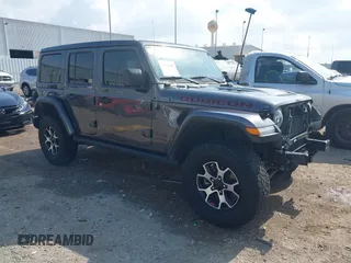 2021 Jeep Wrangler Unlimited Rubicon z VIN 1C4HJXFG0MW556857, wystawiony jako IAAI lot #42103688 z przebiegiem 80 570 mil mil oraz . Historia ofert i sprzedaży dostępna na DreamBid. Obrazek 1.