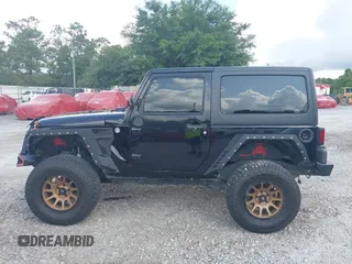2012 Jeep Wrangler Sport z VIN 1C4AJWAG2CL286680, wystawiony jako IAAI lot #42434411 z przebiegiem 97 142 mil mil oraz . Historia ofert i sprzedaży dostępna na DreamBid. Obrazek 14.