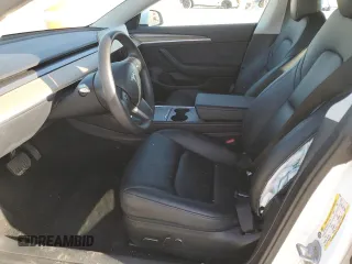 2023 Tesla Model 3 with VIN 5YJ3E1EA4PF631304, listed as a Copart auction lot 52500695 with 33,024 mi miles and Salvage title. Bid and sale history available at DreamBid. Image 7.