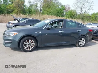 2016 Kia Optima LX with VIN KNAGT4L37G5073752, listed as a IAAI auction lot 42132621 with 136,818 mi miles. Bid and sale history available at carsss.com. Image 14.