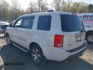 2013 Honda Pilot Touring with VIN 5FNYF4H97DB069979, listed as a IAAI auction lot 42133922 with 276,574 mi miles and . Bid and sale history available at carsss.com. Image 3.